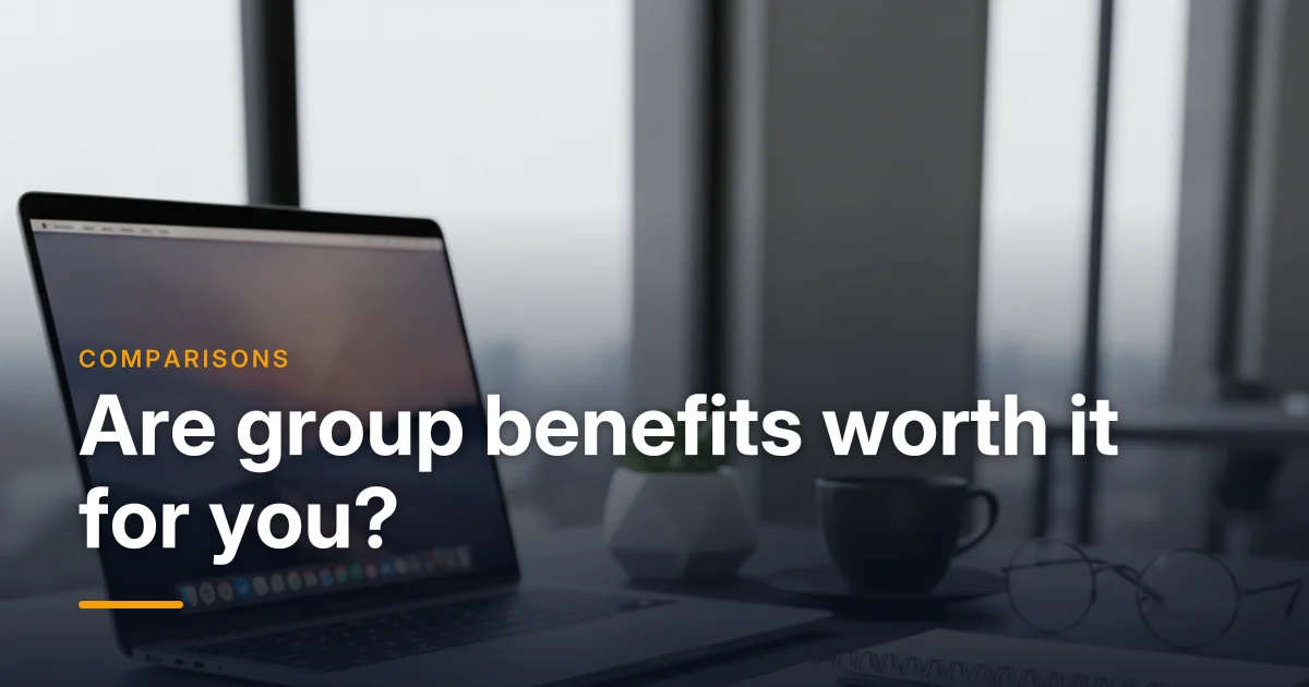 A laptop, coffee and notebook on an office desk — deciding if group benefits are worth it for a small business