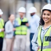 Happy construction worker because she has great group benefits